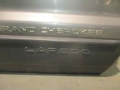 Replacement front right door for Jeep Grand Cherokee (WJ/WG) 3.1 TD CAT OEM IAM reference 55135920AB GREY 5 DOORS